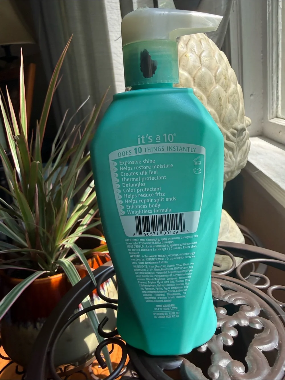 It's a 10 Miracle Glossing Glaze Conditioner — Teal Bottle